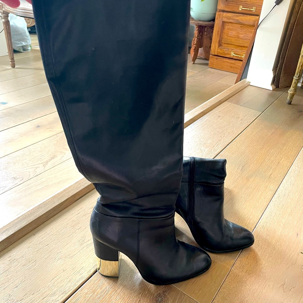 Aldo leather boots with gold heel and zipper side.